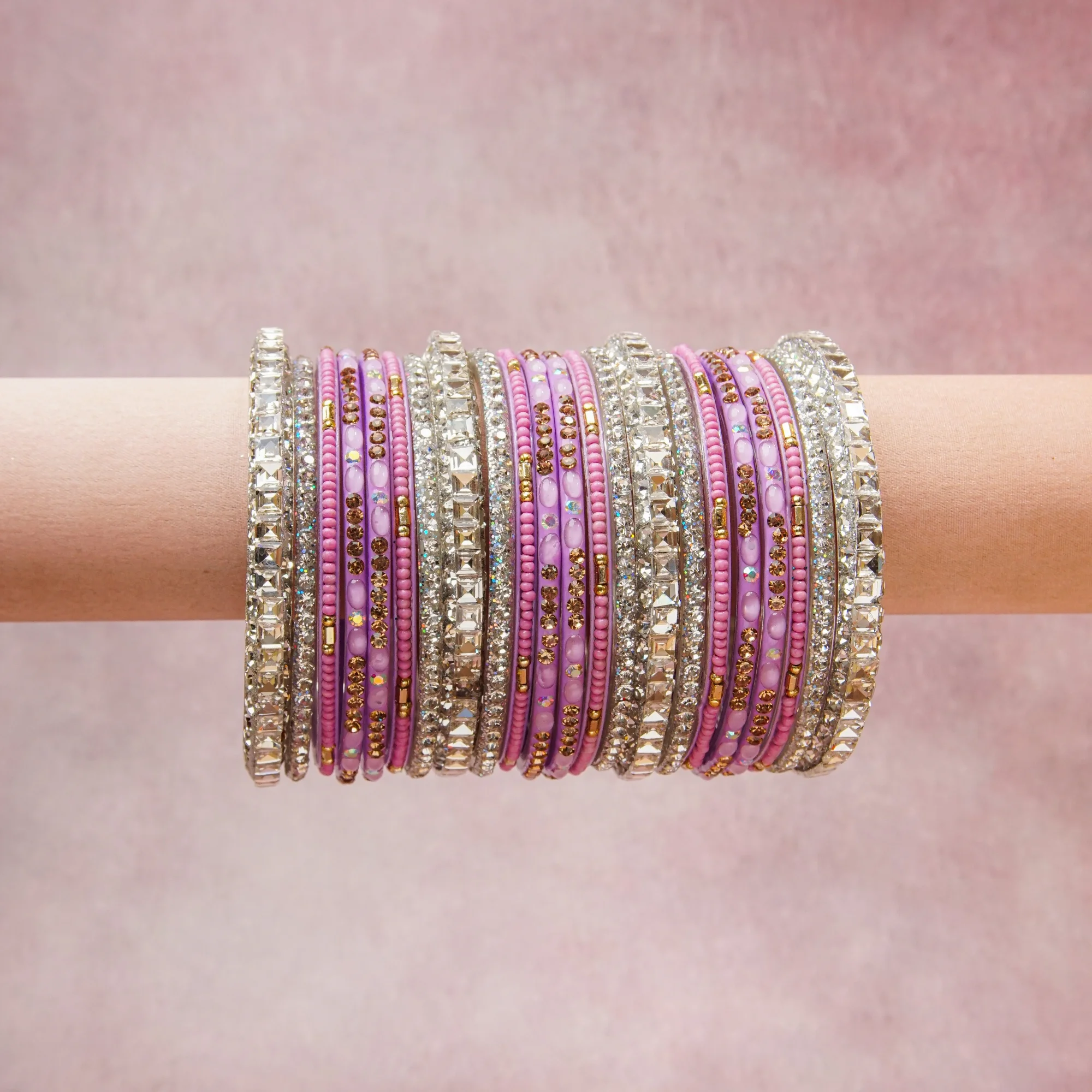 A grounding Lavender forms the heart of the set, while touches of Gold add charm.

A thoughtful composition of Silver-tone Metal, Rhinestones, Glass, Enamel, designed to feel complete without being heavy.
Each element layers seamlessly, creating a look that is refined, wearable and quietly striking.